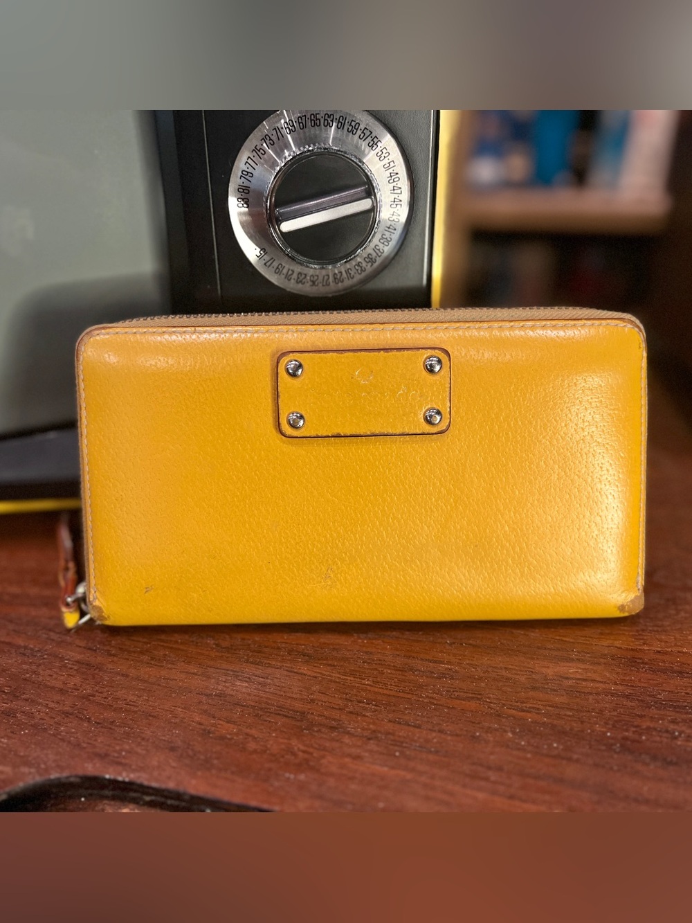 Kate Spade New York zip-around continental wallet in mustard yellow